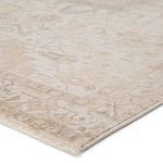 Another angled close-up of the rug’s soft light gray and cream border