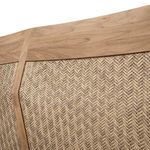 Detailed close-up of woven pattern on sofa back panel and teak border