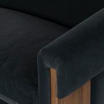 Close-up of sofa seat and arm showcasing soft velvet surface and feather-blend cushions