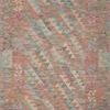 Malik Berry / Multi Rug with warm bohemian geometric patterns in soft blue, pink, and orange tones