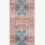 Long runner version of the rug showing a repeated medallion pattern in blue and coral shades