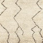 Detailed close-up showing looped and cut high-low texture in rug's geometric pattern