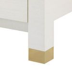 Alternate close-up of brass-capped leg with textured sand white finish