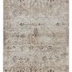 Kati Tribal area rug with a distressed tribal pattern in brown on a cream, gray, tan, and deep brown striated background