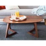 Front view of Godenza coffee table styled with a round copper tray and drinks, in living room setting
