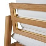 Close-up of loveseat arm joint showing teak wood texture and matte finish