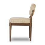 Profile side view showing chair’s slender frame, cushioned seat depth, and upright backrest