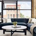 Detailed view of corner seam between back pillow and base of Grant sectional in charcoal twill fabric