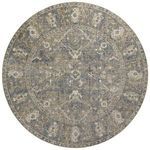 Round version of the rug with circular antique-inspired medallion and border in fading blue and sand tones