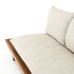 Close-up of seat and back cushions with textured fabric and wrapped rope back support