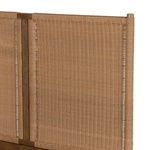 Close side angle of woven headboard panel attached to solid wood frame