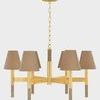 Front view of chandelier emphasizing uniform height of grasscloth shades and brass structure