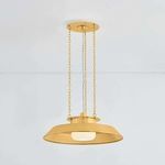 Woodrow Pendant lit, revealing opal shiny shade beneath gold reflector from front angle