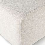 Close-up of rounded edge seam detail on Hobson chair's boucle upholstery