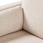 Corner seat close-up of Toland sectional showing cushion joint in cream basketweave fabric