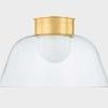 Side view of Lakeside Flush Mount showing clear glass shade and aged brass canopy