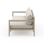 Side angle showing thick, textured cushions with woven cotton backing on outdoor sofa