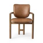 Front view of chair emphasizing barrel back cushioning and tubular wooden frame
