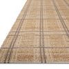 Angled view highlighting the flat-weave texture and plaid pattern of Judy Natural / Stone Rug