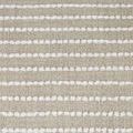 Close-up of upholstery fabric showing raised white yarn textures on beige woven background