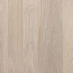 Close-up of the natural wood grain and subtle tonal variations on a drawer front