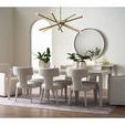 Avaline Dining Table styled in dining room setting with upholstered chairs and rug