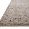 Low angled side view emphasizing thin profile and smooth finish of the Lyra Natural / Gold rug