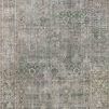 Traditional jewel-toned rug in emerald and antique ivory with vintage-inspired medallion pattern and decorative border.