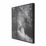 Angled perspective highlighting frame thickness and corner joins on the black maple frame