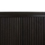 Close-up of ribbed oak veneer texture on the console front panel in dark finish.
