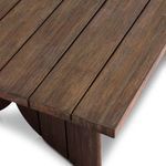 Detailed close-up of teak table edge showing wood grain and plank thickness