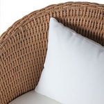 Close-up showing white knife edge back cushion inside the wicker barrel-shaped chair back
