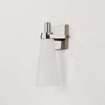 Side view of unlit Trude Wall Sconce highlighting smooth conical shape of frosted glass shade