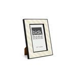 Black and white resin frame angled to show side profile and brown easel back stand