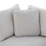 Close-up of seat and back cushions meeting at corner with subtle fabric weave visible