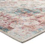 Close-up angled view showing woven polyester texture and stitched edge of the traditional rug