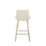 Back view of stool with gently flared white seat and gold legs with footrest