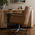 Humphrey Desk Chair side view styled in wooden office setting with desk and decor