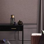 Mauve wallpaper applied on wall behind black desk with decorative glass vases and dusky mauve curtains
