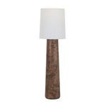 Floor lamp shown from slight angle with tapered wood base and white shade