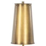 Partial side view showing lamp's white orb base with textured surface and gold tapered shade