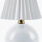 Ferez accent table lamp with glossy white round ceramic base and pleated white linen shade with brass neck
