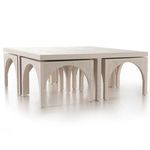 Angled side view focusing on arched legs and smooth white oak finish of the table