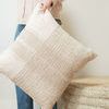 Person holding pillow showing its scale compared to human torso