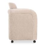 Right side view showing chair’s gently rounded armrest and straight back in beige fabric