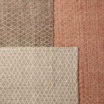 Three rugs stacked showing color variations in gray beige, cream, and muted coral