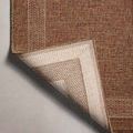 Corner flipped up to reveal light beige non-slip backing with woven texture