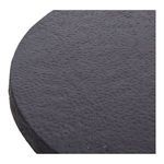 Close-up of coffee table's rough indented texture on black circular top