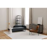 Living room context with Book table near dark blue sofa and leather chair, featuring modern neutral decor