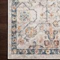 Close-up of rug corner on dark hardwood floor highlighting border details and pile softness